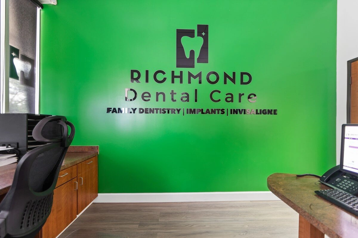 Richmond Dental Care logo wall at reception